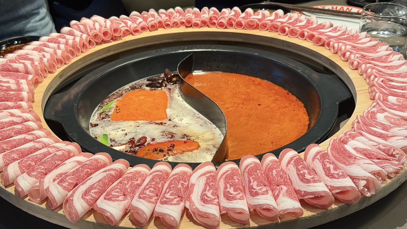 Hot pot with yin-yang broth and meat ring